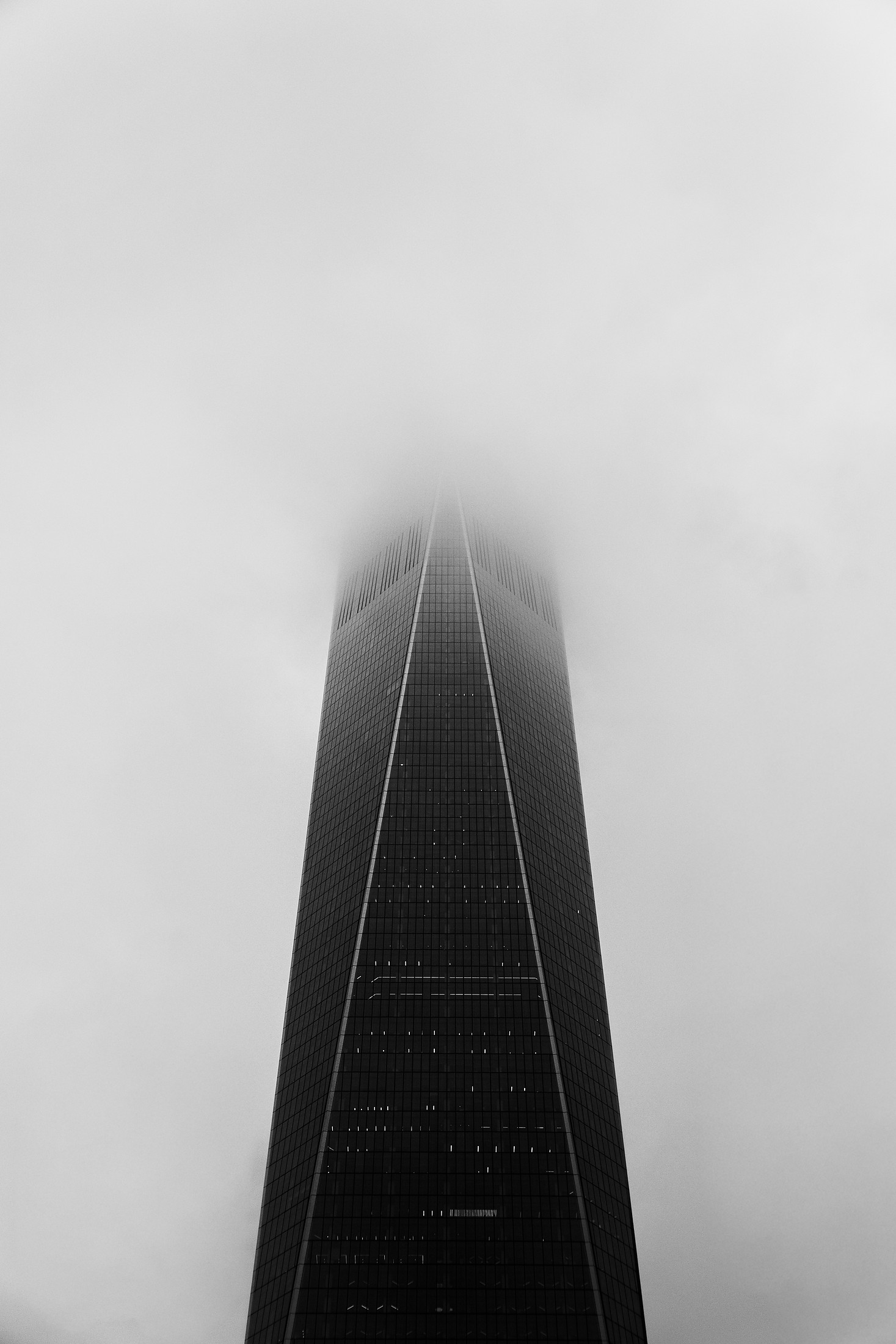 Skyscraper disappearing into the fog